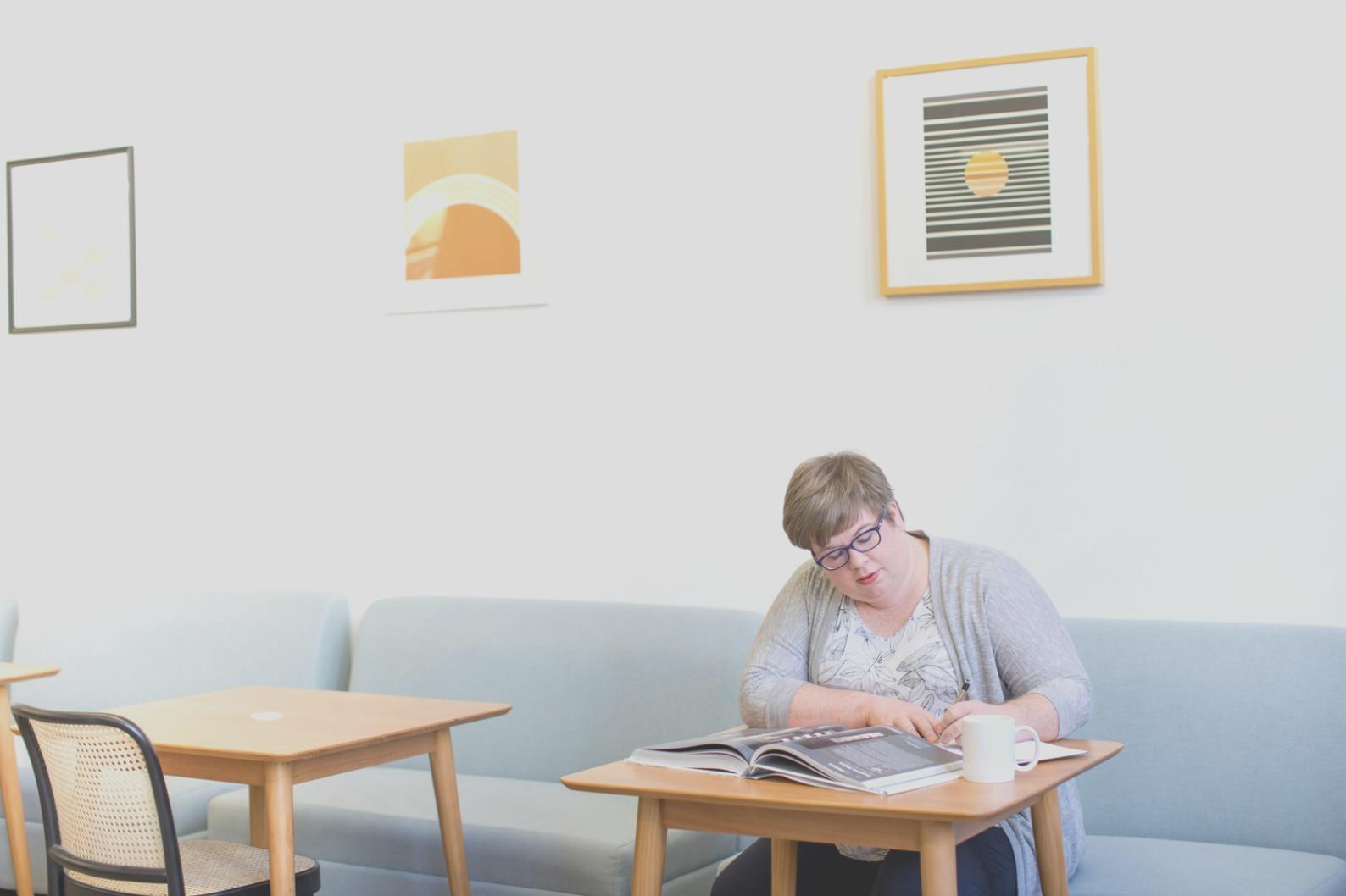 Modern office workspace with financial planning documents and digital tools